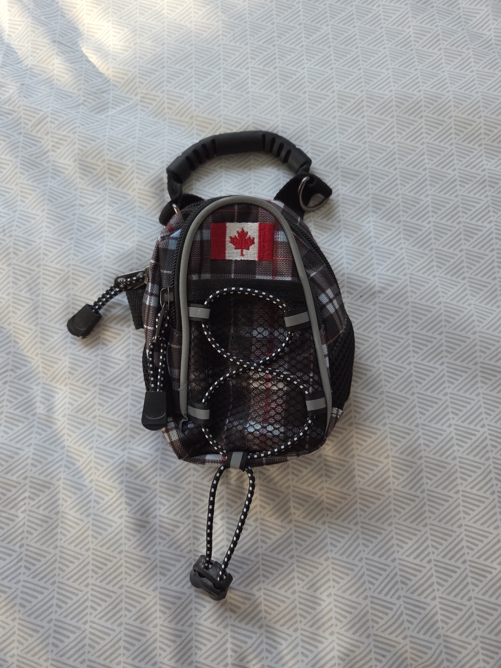 Compact Black and Gray Plaid Sling Bag with Canadian Flag Patch